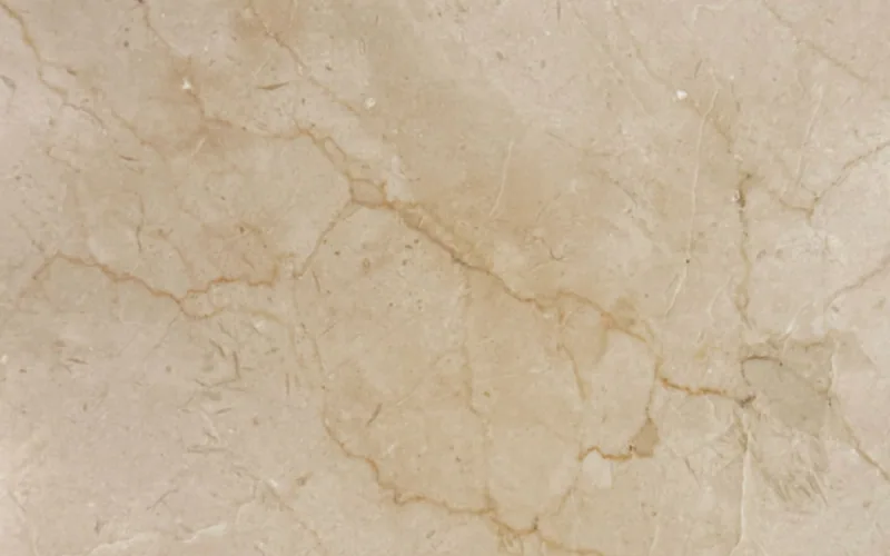 Textura de mármol Crema Marfil, uno de los tonos usados en mesones de baño